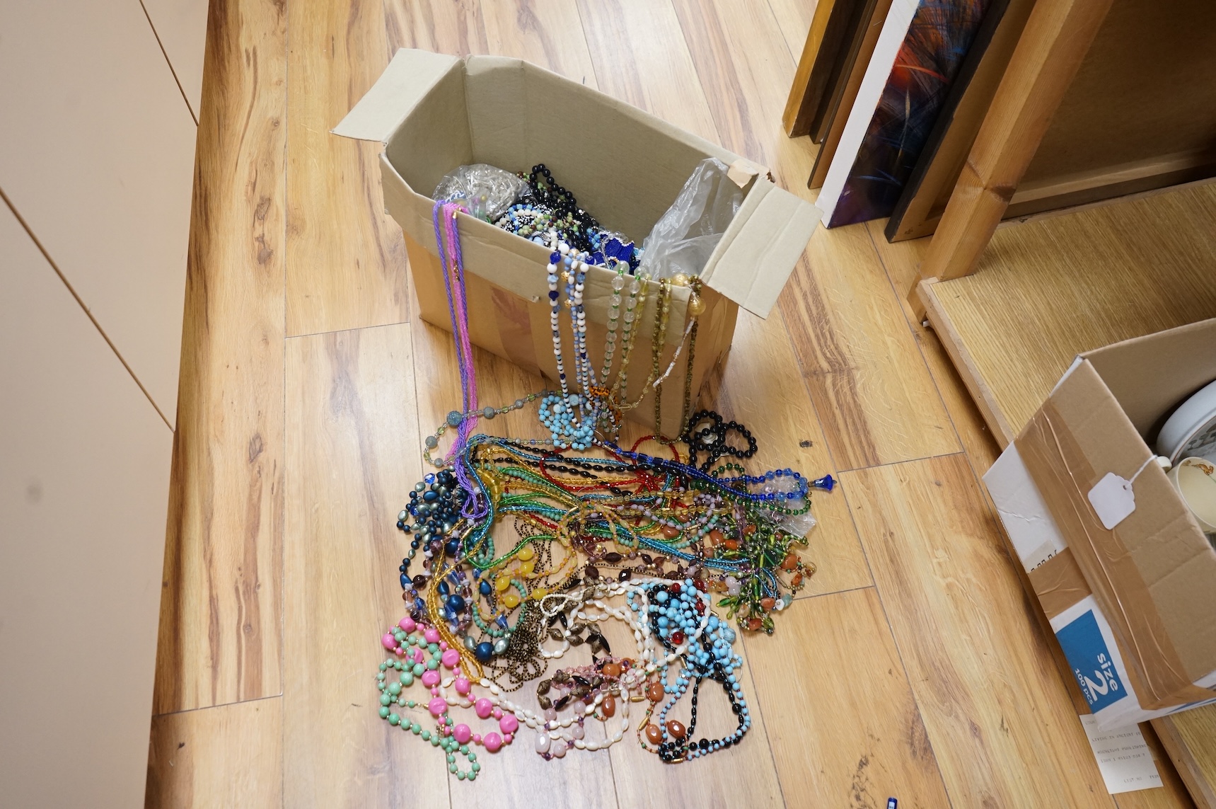A large collection of glass bead necklaces